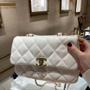 Absolutely stunning rare brand New Coco Chanel travel purse with handle .A must!